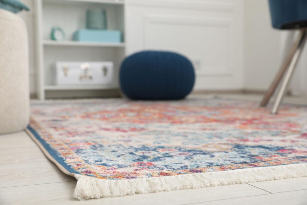 Colorful patterned rug in cozy living room with modern decor and soft textures